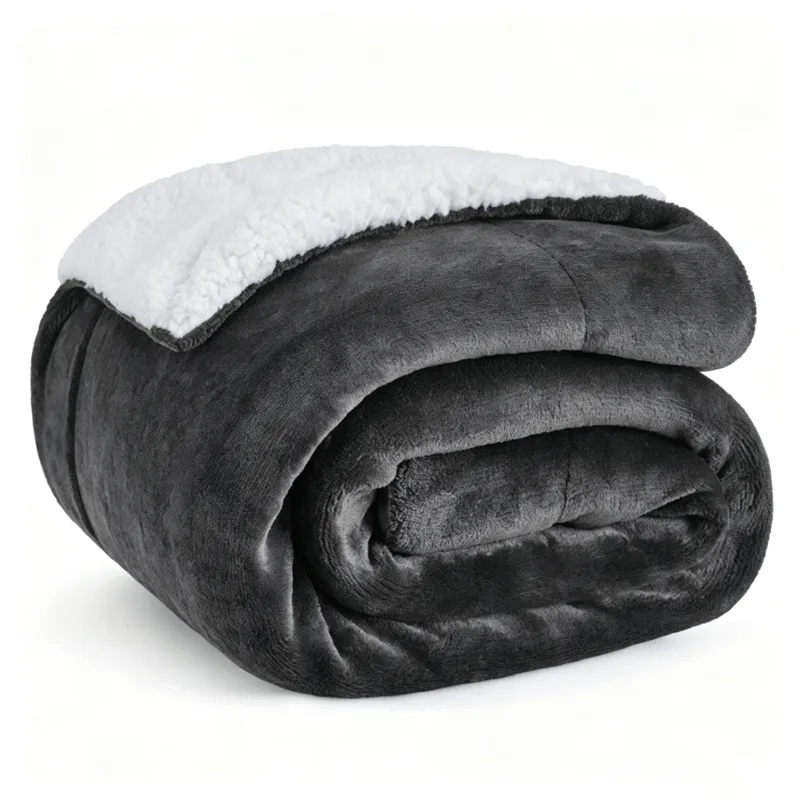 Dark gray sherpa fleece blanket on bed