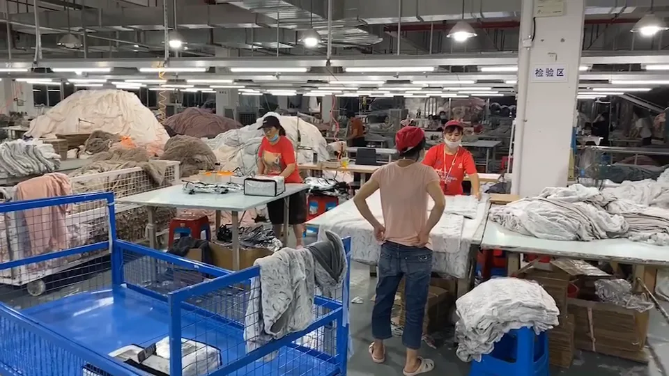 Quality inspection area where workers check finished blankets